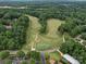 Aerial view of golf course, neighborhood, and clubhouse at 4025 Foxes Trl, Cramerton, NC 28032