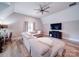 Spacious living room featuring a large sectional sofa, a ceiling fan, and recessed lighting at 4025 Foxes Trl, Cramerton, NC 28032