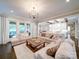 Open-concept living area with hardwood floors and seamless transition to kitchen at 4025 Foxes Trl, Cramerton, NC 28032