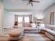 Open concept living area with hardwood floors, a large sofa, and ample natural light at 4025 Foxes Trl, Cramerton, NC 28032