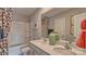 Bright bathroom features double sinks, modern cabinets and a shower/tub combo at 4033 Cramer Estates Ct, Gastonia, NC 28056