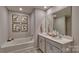 Bright bathroom features double sinks, modern cabinets and a soaking tub at 4033 Cramer Estates Ct, Gastonia, NC 28056
