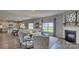 Cozy living room with an open floor plan connecting to the kitchen and dining area at 4033 Cramer Estates Ct, Gastonia, NC 28056