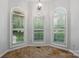 Close up of arched windows with white shutters bringing natural light to the room at 4133 Hoffmeister Dr, Waxhaw, NC 28173