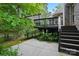 Backyard with a patio, stairs leading to deck, plants and trees, perfect for enjoying the outdoors at 4133 Hoffmeister Dr, Waxhaw, NC 28173