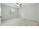 Neutral bedroom offers carpeted flooring and a large window with shutter blinds at 4133 Hoffmeister Dr, Waxhaw, NC 28173