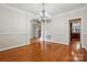 Open dining room featuring hardwood floors, modern lighting and an abundance of natural light at 4133 Hoffmeister Dr, Waxhaw, NC 28173