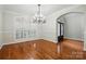 Open dining room featuring hardwood floors, modern lighting and an abundance of natural light at 4133 Hoffmeister Dr, Waxhaw, NC 28173