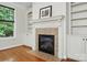 Close up of fireplace featuring tile surround and mantle with built-in shelving at 4133 Hoffmeister Dr, Waxhaw, NC 28173