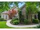 Beautiful front yard with lush landscaping and mature trees surrounding the brick home at 4133 Hoffmeister Dr, Waxhaw, NC 28173