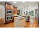 Beautiful kitchen island with granite countertops and stainless appliances at 4133 Hoffmeister Dr, Waxhaw, NC 28173