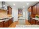 Gourmet kitchen featuring custom cabinetry, stainless steel appliances, and a center island at 4133 Hoffmeister Dr, Waxhaw, NC 28173