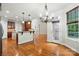Open concept kitchen featuring hardwood floors, modern lighting, and access to the outside at 4133 Hoffmeister Dr, Waxhaw, NC 28173
