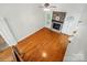 Open living room features hardwood floors, stone fireplace, and vaulted ceilings with lots of natural light at 4133 Hoffmeister Dr, Waxhaw, NC 28173