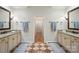 Well-lit main bathroom with double vanity, granite countertop, decorative tile, and an entrance to the main bedroom at 4133 Hoffmeister Dr, Waxhaw, NC 28173