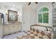 Bright bathroom with granite countertops, soaking tub, glass shower, and tile flooring at 4133 Hoffmeister Dr, Waxhaw, NC 28173