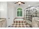 Bright bathroom with a soaking tub, glass shower, and arched window bringing in natural light at 4133 Hoffmeister Dr, Waxhaw, NC 28173