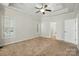 Large main bedroom with tray ceiling and ceiling fan. Bright with great natural light at 4133 Hoffmeister Dr, Waxhaw, NC 28173