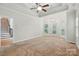 Spacious main bedroom with a tray ceiling, ceiling fan, and three large arched windows at 4133 Hoffmeister Dr, Waxhaw, NC 28173
