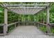 Large wooden pergola atop backyard deck, perfect for outdoor enjoyment and relaxation at 4133 Hoffmeister Dr, Waxhaw, NC 28173