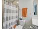 Neutral toned bathroom featuring a shower/tub combo, with towel and bathmat at 419 Wade St, Wadesboro, NC 28170