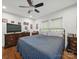 Bedroom featuring hardwood floors, ceiling fan, and dresser set at 419 Wade St, Wadesboro, NC 28170