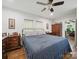 Comfortable bedroom with hardwood floors, dresser set, and natural light at 419 Wade St, Wadesboro, NC 28170