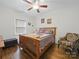 Bedroom with wood-look floors, a ceiling fan, and an accent chair at 419 Wade St, Wadesboro, NC 28170