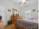 Bedroom featuring a wooden dresser, hardwood floors, and a ceiling fan at 419 Wade St, Wadesboro, NC 28170