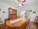 A spacious dining room featuring hardwood floors and a large wooden hutch at 419 Wade St, Wadesboro, NC 28170