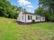 White brick home with black shutters and lush, green lawn at 419 Wade St, Wadesboro, NC 28170