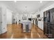 Spacious kitchen features a large island, stainless appliances, white cabinets, and hardwood floors at 419 Wade St, Wadesboro, NC 28170