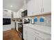 Well-lit kitchen showcases stainless steel appliances, white cabinets, and beautiful countertops at 419 Wade St, Wadesboro, NC 28170