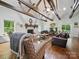 Inviting living room with exposed beams, fireplace, hardwood floors, and a comfortable seating arrangement at 419 Wade St, Wadesboro, NC 28170
