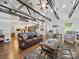 Bright living space flows into a modern kitchen, showcasing hardwood floors and ample space for entertaining at 419 Wade St, Wadesboro, NC 28170