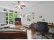 Inviting living room with large windows offering natural light, plus hardwood floors and comfortable seating at 419 Wade St, Wadesboro, NC 28170