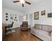 Relaxing living room featuring hardwood floors, a comfortable sofa and armchair, and natural light at 419 Wade St, Wadesboro, NC 28170