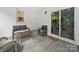 Comfortable back porch with neutral toned furniture, a ceiling fan, and an open sliding glass door at 419 Wade St, Wadesboro, NC 28170