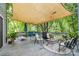 Spacious back deck with comfortable seating under a canvas shade, perfect for outdoor relaxation at 4236 Carrington Sw Ct, Concord, NC 28027