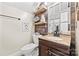 Charming bathroom featuring a stylish vanity, rustic wood accents, and updated fixtures at 4236 Carrington Sw Ct, Concord, NC 28027
