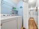 Bright laundry room with shelving and washer/dryer hookups for easy chore completion at 4236 Carrington Sw Ct, Concord, NC 28027