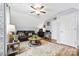 Inviting living room with cozy seating, ceiling fan, and natural light; perfect for relaxation at 4236 Carrington Sw Ct, Concord, NC 28027