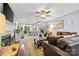 Spacious living room featuring a fireplace, comfortable seating, and an open view to the dining area at 4236 Carrington Sw Ct, Concord, NC 28027