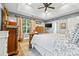 Spacious main bedroom featuring a trey ceiling, ceiling fan, and plenty of natural light at 4236 Carrington Sw Ct, Concord, NC 28027