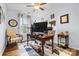 Functional home office space with a large desk, ample lighting, and comfortable seating at 4236 Carrington Sw Ct, Concord, NC 28027