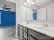 Bathroom features a double sink vanity with dark cabinetry and a view into an adjoining room at 4576 Fox Ridge Ln, Fort Mill, SC 29707
