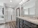 Bathroom featuring double sink vanity, a glass-enclosed shower, and neutral décor at 4576 Fox Ridge Ln, Fort Mill, SC 29707