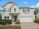 Charming two-story home featuring light blue siding, a two-car garage, and well-manicured landscaping at 4576 Fox Ridge Ln, Fort Mill, SC 29707
