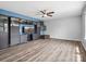 Bright living room showcasing wood-look floors, a built-in entertainment center, and modern design at 4576 Fox Ridge Ln, Fort Mill, SC 29707