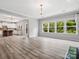 Open concept living and kitchen area featuring lots of natural light, hardwood floors, and modern design at 4576 Fox Ridge Ln, Fort Mill, SC 29707